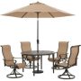Hanover Brigantine 5-pc Aluminum Outdoor Dining Set with 4 Swivel Rockers, Round Cast-Top Table, 9 ft. Umbrella and Base - Image 1
