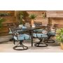 Hanover Montclair 7-pc Steel Outdoor Dining Set with Ocean Blue Cushions Swivel Rockers and Dining Table - Image 1